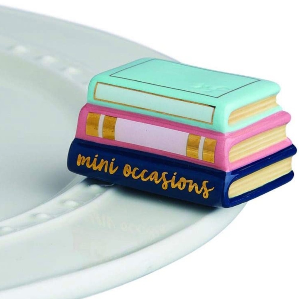 Nora Fleming mini: stack of books - retired